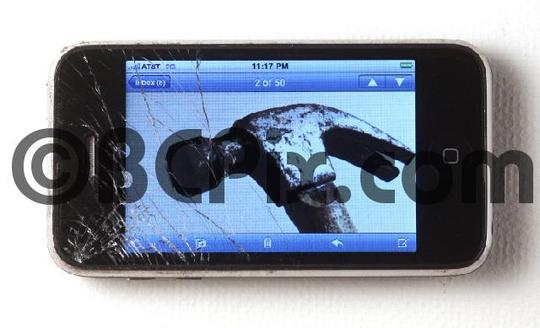 Product picture Cracked smart phone with photo of hammer on its screen