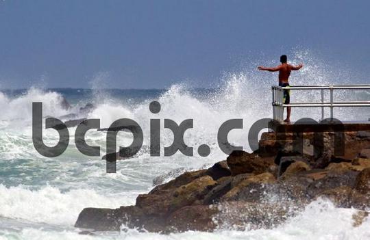 Product picture Man watches Hurricane Irene waves
