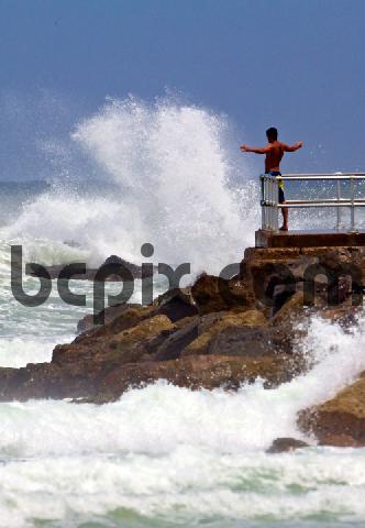 Product picture Man watches Hurricane Irene waves